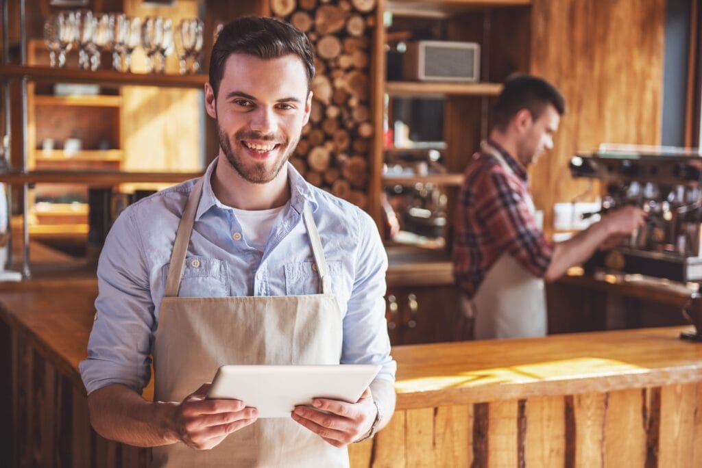Handsome waiter at cafe