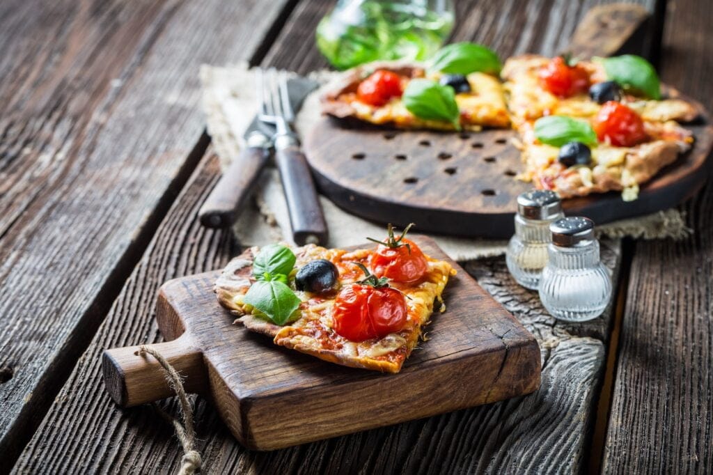 Tasty pizza made of cheese and tomatoes. Pizza with mozzarella.